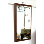 A teak framed oblong wall mirror