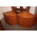 A pair of teak G-plan bow fronted corner cupboards