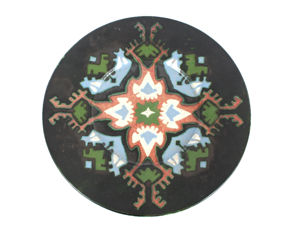 A Riga pottery charger, signed A. Sirotin, 43cm di