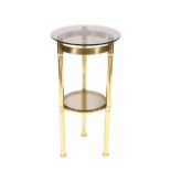 A brass and smoked glass two tier circualr plant s