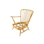 A low light Ercol stick back easy chair, raised on