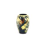 A Moorcroft baluster vase, having reed and lily pa