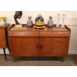 A David Joel Limited Danish design teak sideboard, fitted two blind frieze drawers with cupboards be