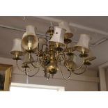 A Dutch style brass eight branch chandelier