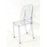 A pair of retro Perspex dining chairs
