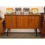 A Lebus sideboard, fitted three short drawers with