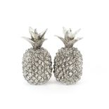 A pair of silvered pineapple ornaments, 29cm high