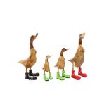 Four wooden booted duck ornaments