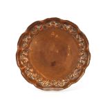 A copper circular Arts & Crafts dish, 25cm dia.