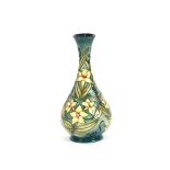 A Moorcroft baluster vase with slender neck, flowe