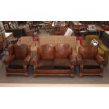 A 1930's leather two seater settee, matching e