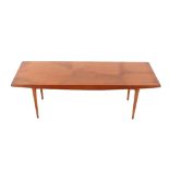 A teak oblong coffee table, raised on square taper