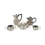 An Art Deco spot hammered pewter three piece tease