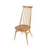 A set of four light Ercol stick back dining chairs