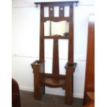 An Arts & Crafts oak hall seat/stand, having mirro