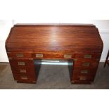 A Filipino hardwood Campaign style roll top desk, the tambour shutter opening to reveal a fitted int