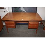 A teak G-plan design desk fitted four drawers, 129