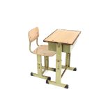 A mid-20th Century adjustable child's school desk