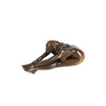 A small erotic bronze figure depicting a bound and