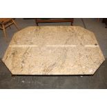 A Brazilian marble coffee table, raised on bronzed supports, 139cm