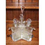 An Arts & Crafts design plated decanter stand, fit