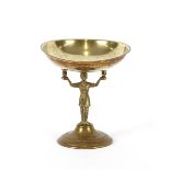 A brass Tazza, raised on figural base, 22cm high x