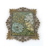 A panel of William Morris design material, in gilded meta