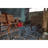 A metal garden table with four matching chairs, an