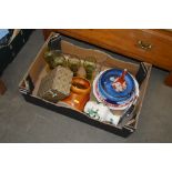 A box containing various decorative china to inclu