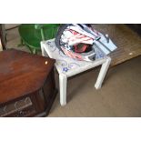 A white painted tile topped coffee table