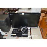 A Grundig flat screen television with remote contr
