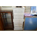 A pair of white painted bedside chests fitted thre