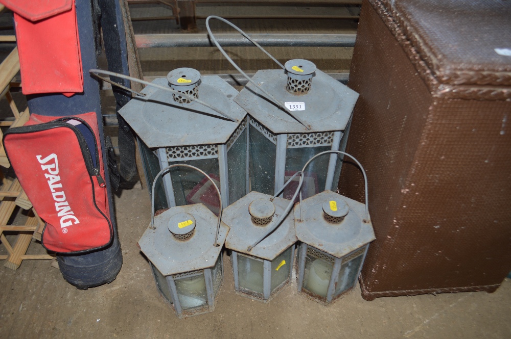 Five metal and glass hanging candle lanterns