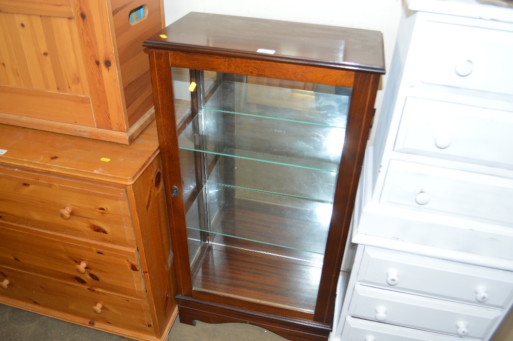 A reproduction mahogany cabinet