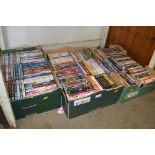 Three boxes of various DVDs