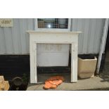 A white painted fire surround