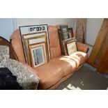 An orange leather upholstered three seat settee