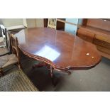 An Italian style reproduction dining table