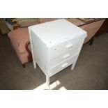 A white painted three drawer chest