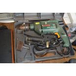 A Bosch hammer drill in fitted case