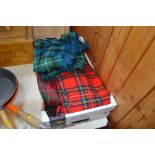 A box containing four kilts