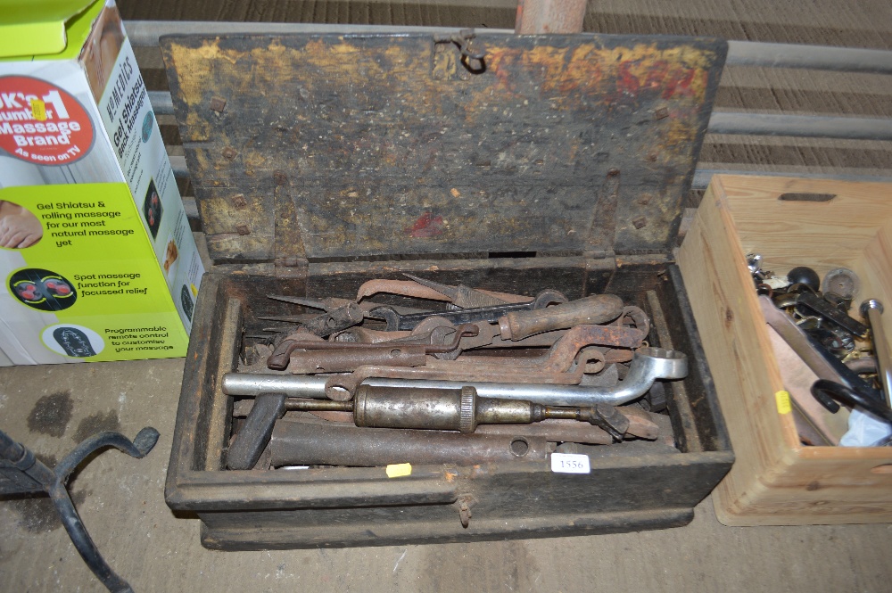 A wooden tool box and contents