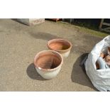 A pair of terracotta planters