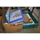 Two boxes of various games and puzzles