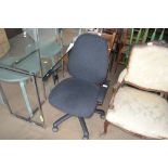 A black upholstered swivel office chair