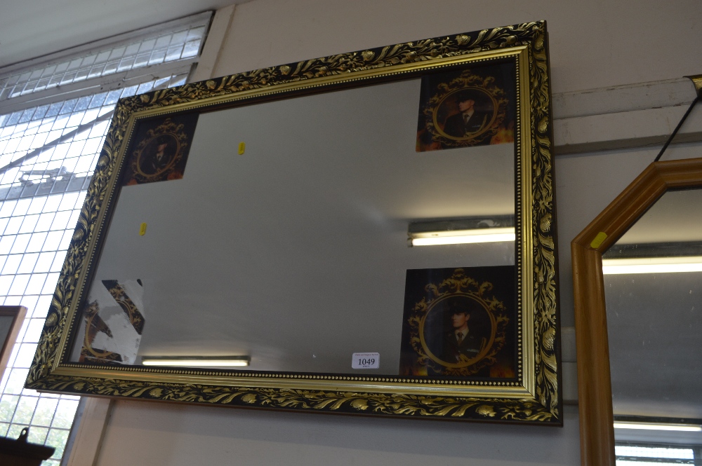 A commemorative gilt framed wall mirror