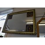 A commemorative gilt framed wall mirror