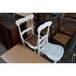 Two white painted bar back chairs