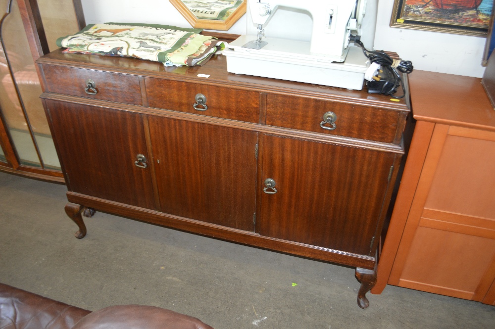 A reproduction mahogany side board fitted drawers