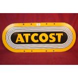 An enamel oval advertising sign for "Atcost", 30cm x